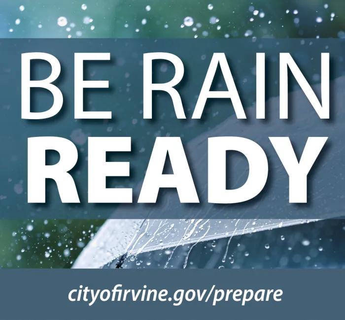 An umbrella with rain falling on it. The City of Irvine logo is in the lower right corner. In front of the umbrella are the words Be Rain Ready and at the bottom is cityofirvine.gov/prepare