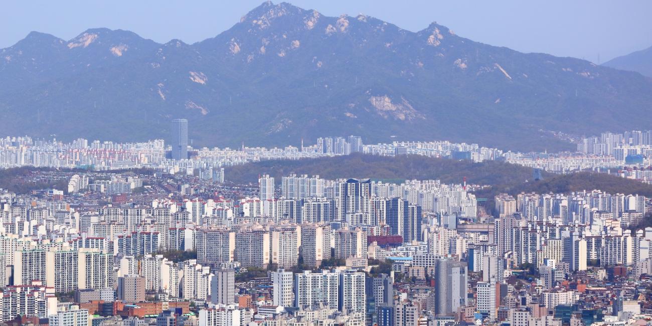 Seoul cityscape in South Korea with mountains in the back