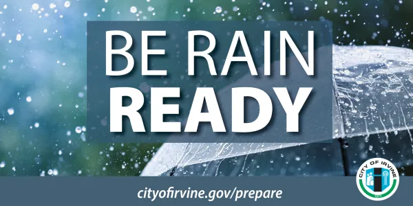 An umbrella with rain falling on it. The City of Irvine logo is in the lower right corner. In front of the umbrella are the words Be Rain Ready and at the bottom is cityofirvine.gov/prepare