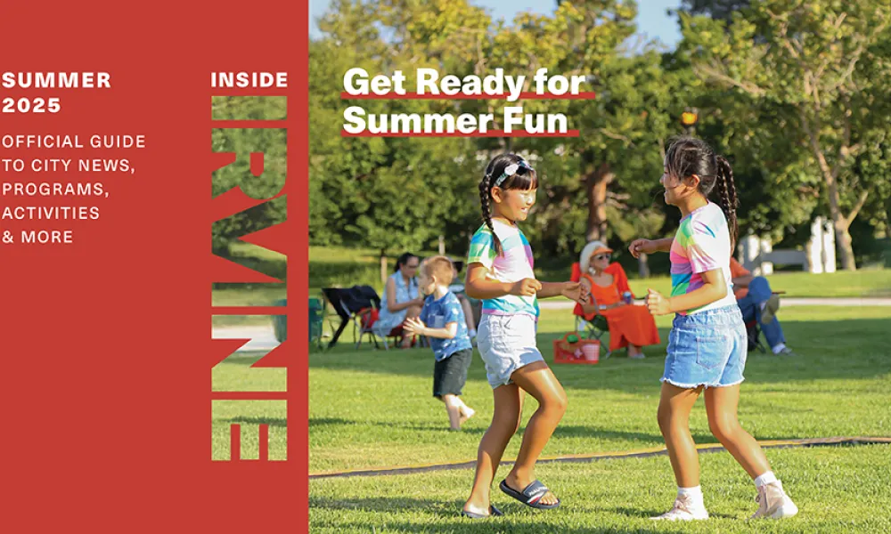 photo of magazine cover with children playing outside with the words "Get Ready for Summer Fun" as the subtitle of the magazine. 