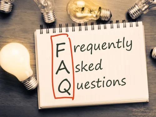 Spiral notebook with FAQ letters boxed and spelled out to display frequently asked questions