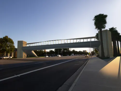 White bridge spanning a street 